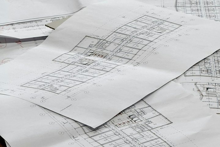 House blueprints spread on a table